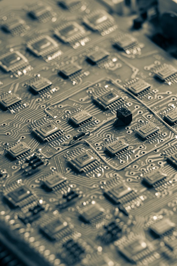 Detailed close-up of a microchip circuit board showcasing intricate electronic patterns.
